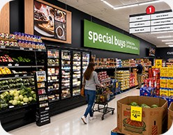 Save A Lot grocery aisle with refreshed shelf and aisle signage