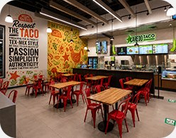 Laredo Taco Company dining area with branded wall graphics