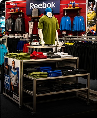 Reebok apparel display inside a sporting goods store