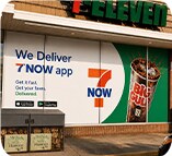 7-Eleven We Now Deliver promotional signage