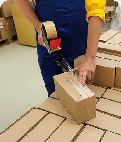 Boxes being taped and palletised for distribution