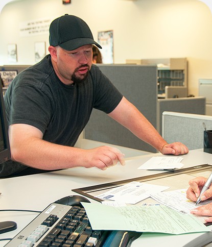 Permit paperwork being reviewed at a desk