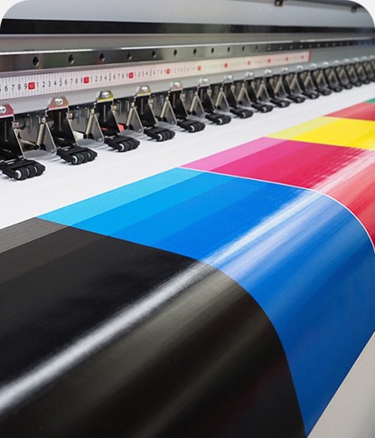 Large-format press running CMYK rolls